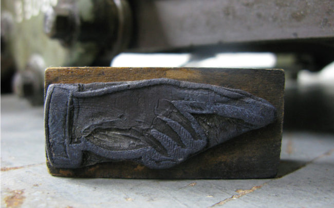 image of a rubber stamp of manicule